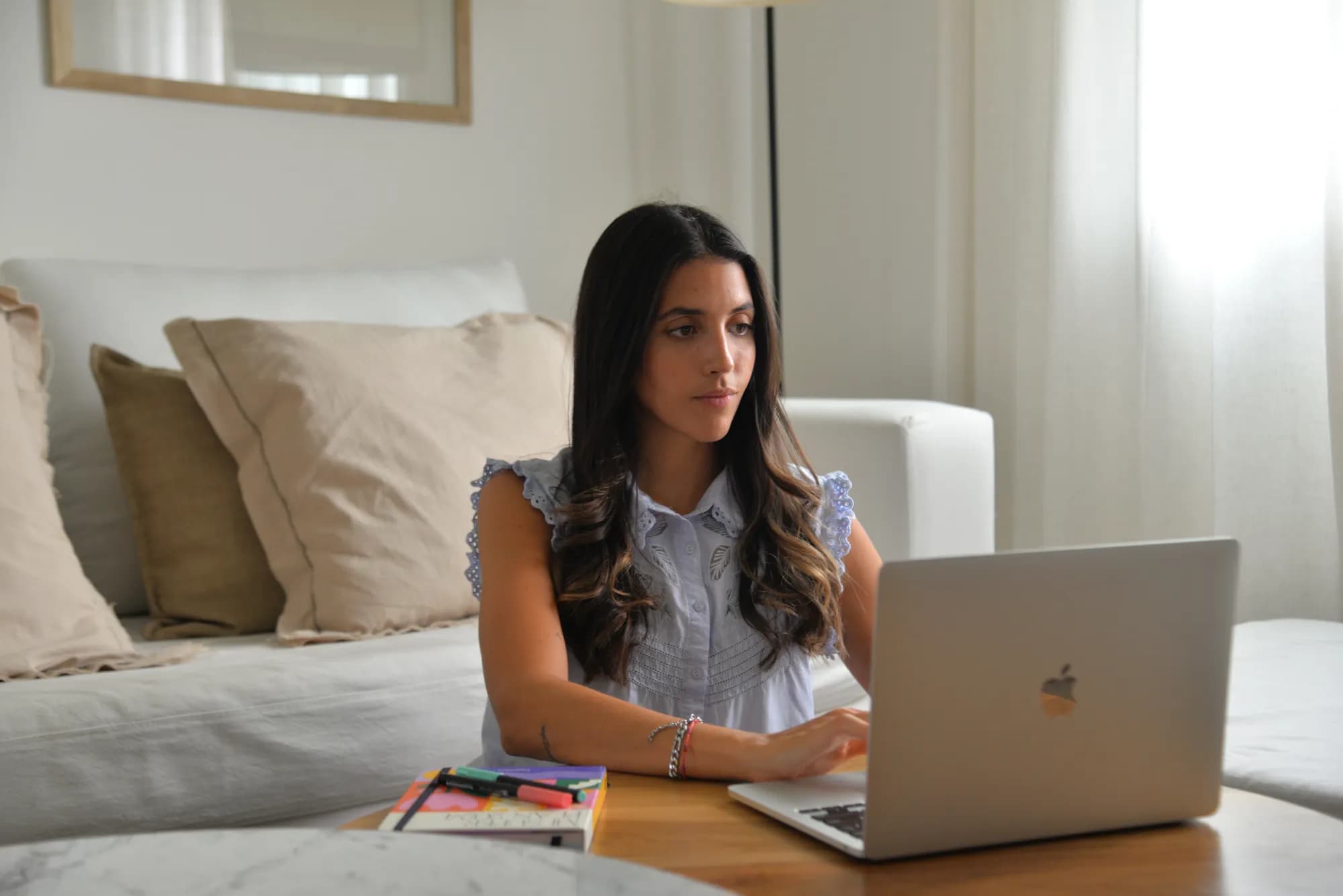 Agustina Lasteche working at her desk